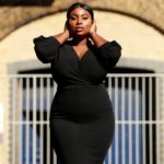 Olakemi - A curvy plus size model wearing a sexy plus size black dress by @boohoo