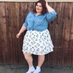 Melissa Jantina - Plus size model wearing a plus size denim top and white flower skirt from @torridfashion