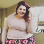 Melissa Jantina - Plus size model wearing a plus size pink sweater and plus size flower skirt