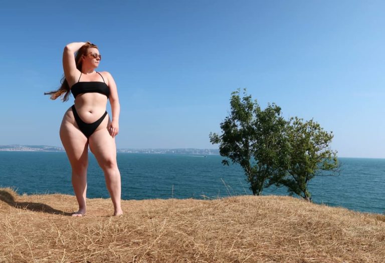 Curvy plus size fitness model Nicole Herring aka @nlhfit modeling a sexy black plus size two piece bikini