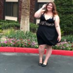 Melissa Jantina - Plus size model wearing a sexy plus size black dress