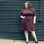 Jenna Lee (@jennsgotcurves) is wearing a plus size black and red dress