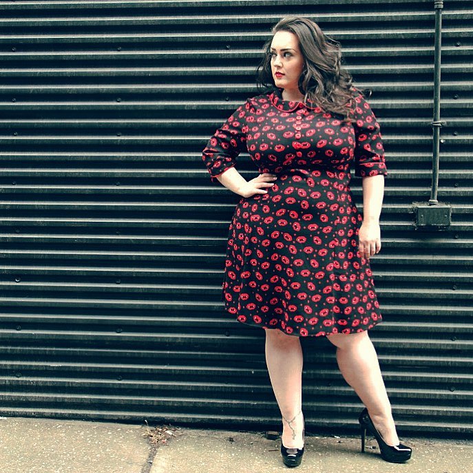 Jenna Lee (@jennsgotcurves) is wearing a plus size black and red dress