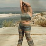 Alexa Phelece - plus size model wearing a plus size retro top and hip hugging pants