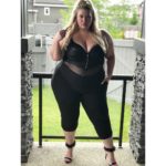 Lyndsay Patricia (aka PlusSizeBarbiiee) - plus size model - wearing a plus size black body suit by @xeharcurvy