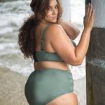 Plus Model Erica Lauren modeling a plus size two piece green swimsuit