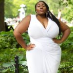 Plus size model Jezra Matthews (Jezra M) modeling a white plus size dress