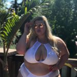 Lyndsay Patricia (aka PlusSizeBarbiiee) - plus size model - wearing a plus size one piece white swimsuit by @playfulpromises