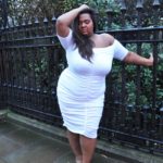 Kat Henry - Plus Size Model, Ms International Curve ‘17/18, Ms British Beauty Curve '15, Ridge Radio DJ,Blogger, Body Positive Activist - modeling a plus size white dress