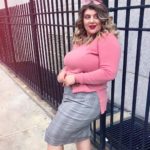 Alexa Phelece - plus size model wearing a plus size pink sweater and plus size gray skirt by @maree_pour_toi
