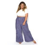 Alexa Phelece - plus size model wearing a plus size white top and a pair of plus size blue and white striped pants from @astrasignature